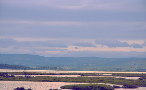 A view of a landscape with a lot of clouds